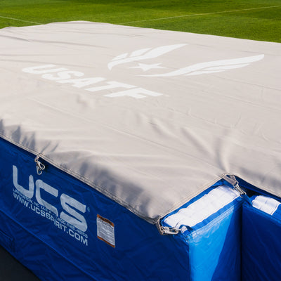 Top landing pad in grey for a high jump pit with blue base pads